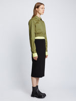 Side full length image of model wearing Cotton Twill Bomber Jacket in KHAKI GREEN with jacket zipped
