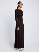 Side full length image of model wearing Long Sleeve Jersey Open Back Dress in BLACK