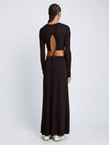 Back full length image of model wearing Long Sleeve Jersey Open Back Dress in BLACK