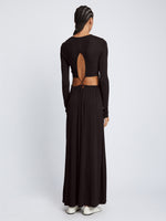 Back full length image of model wearing Long Sleeve Jersey Open Back Dress in BLACK