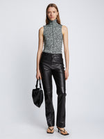 Front full length image of model wearing Slinky Jersey Turtleneck Top in BLACK/WHITE/JADE