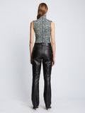 Back full length image of model wearing Slinky Jersey Turtleneck Top in BLACK/WHITE/JADE