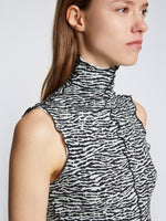Detail image of model wearing Slinky Jersey Turtleneck Top in BLACK/WHITE/JADE