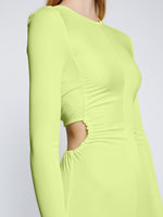 Detail image of model wearing Long Sleeve Jersey Open Back Dress in LIME