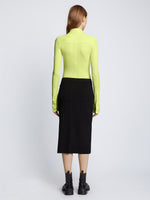 Back full length image of model wearing Long Sleeve Jersey Keyhole Top in LIME