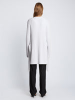 Back full length image of model wearing Ribbed Cotton Relaxed Cardigan in OFF WHITE