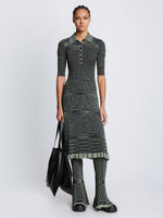 Front full length image of model wearing Space Dye Rib Knit Polo Dress styled over Space Dye Rib Knit Pant in NAVY/LIME/BLACK