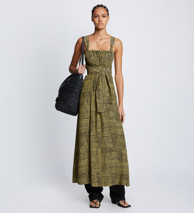 Front full length image of model wearing Viscose Flou Wrap Dress in BLACK/MATCHA with belt tied in front, styled over black Viscose Suiting Pants