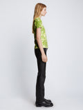 Side full length image of model wearing Tie Dye T-Shirt in GREEN/CITRON