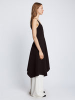 Side full length image of model wearing Barre Bustier Dress in BLACK