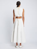 Back full length image of model wearing Poplin Cut Out Midi Dress in OFF WHITE