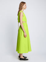 Side full length image of model wearing Poplin Cut Out Midi Dress in GREEN APPLE