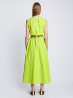 Back full length image of model wearing Poplin Cut Out Midi Dress in GREEN APPLE