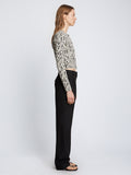Side full length image of model wearing Animal Jacquard Cardigan in BEIGE/BLACK