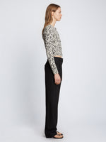 Side full length image of model wearing Animal Jacquard Cardigan in BEIGE/BLACK