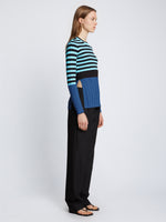 Side full length image of model wearing Slinky Stripe Long Sleeve Sweater in AQUA/BLACK/OXFORD BLUE