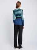 Back full length image of model wearing Slinky Stripe Long Sleeve Sweater in AQUA/BLACK/OXFORD BLUE