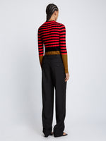 Back full length image of model wearing Slinky Stripe Long Sleeve Sweater in CHERRY/GOLDEN ROD/BLACK