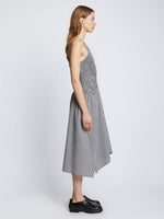 Side full length image of model wearing Gingham Seersucker Smocked Dress in OFF WHITE/BLACK