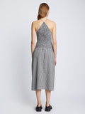 Back full length image of model wearing Gingham Seersucker Smocked Dress in OFF WHITE/BLACK