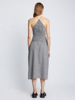Back full length image of model wearing Gingham Seersucker Smocked Dress in OFF WHITE/BLACK