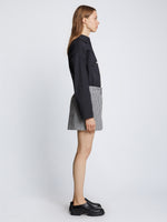 Side full length image of model wearing Gingham Seersucker Boxer Shorts in OFF WHITE/BLACK