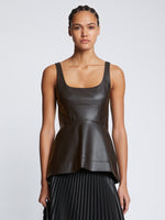 Front cropped image of model wearing Faux Leather Bustier Top in BLACK