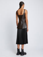 Back full length image of model wearing Faux Leather Bustier Top in BLACK
