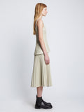Side full length image of model wearing Faux Leather Bustier Top in CHALK