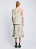 Back full length image of model wearing Faux Leather Bustier Top in CHALK