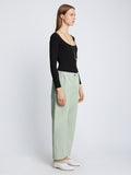 Side full length image of model wearing Solid Cotton Linen Easy Pants in LIGHT SEAFOAM