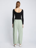 Back full length image of model wearing Solid Cotton Linen Easy Pants in LIGHT SEAFOAM