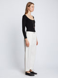 Side full length image of model wearing Solid Cotton Linen Easy Pants in OFF WHITE