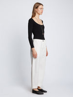 Side full length image of model wearing Solid Cotton Linen Easy Pants in OFF WHITE