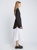 Side full length image of model wearing Soft Poplin Button Down Shirt Dress in BLACK