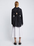 Back full length image of model wearing Soft Poplin Button Down Shirt Dress in BLACK