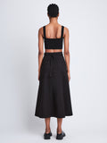 Back full length image of model wearing Soft Poplin Wrap Skirt in BLACK
