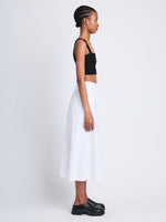Side full length image of model wearing Soft Poplin Wrap Skirt in OFF WHITE