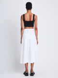 Back full length image of model wearing Soft Poplin Wrap Skirt in OFF WHITE