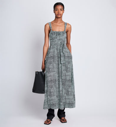 Front full length image of model wearing Viscose Flou Wrap Dress in BLACK/PAPER MINT with belt tied in front, styled over black Viscose Suiting Pants