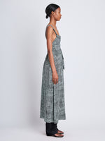 Side full length image of model wearing Viscose Flou Wrap Dress in BLACK/PAPER MINT