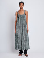Front full length image of model wearing Viscose Flou Wrap Dress in BLACK/PAPER MINT with belt untied, styled over black Viscose Suiting Pants