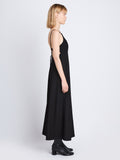 Side full length image of model wearing Drapey Suiting Cut Out Dress in BLACK