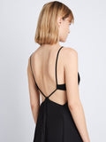 Detail image of model wearing Drapey Suiting Cut Out Dress in BLACK