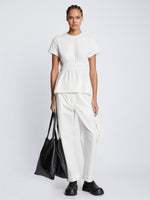 Front full length image of model wearing Ruched Side Tie T-Shirt in OFF WHITE