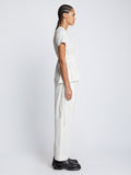 Side full length image of model wearing Ruched Side Tie T-Shirt in OFF WHITE