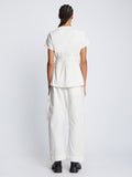 Back full length image of model wearing Ruched Side Tie T-Shirt in OFF WHITE