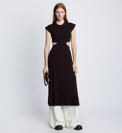Front full length image of model wearing Pointelle Rib Cut Out Knit Dress in BLACK styled over white Drapey Suiting Pants