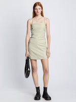 Front full length image of model wearing Faux Leather Ruched Mini Dress in CHALK