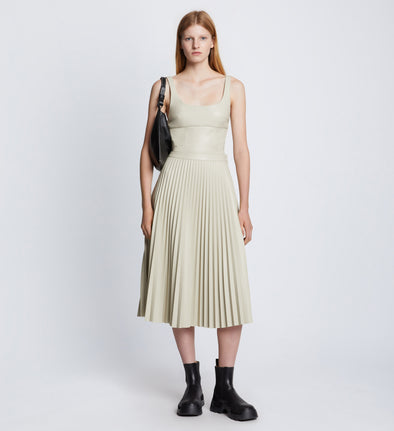 Front full length image of model wearing Faux Leather Pleated Skirt in CHALK